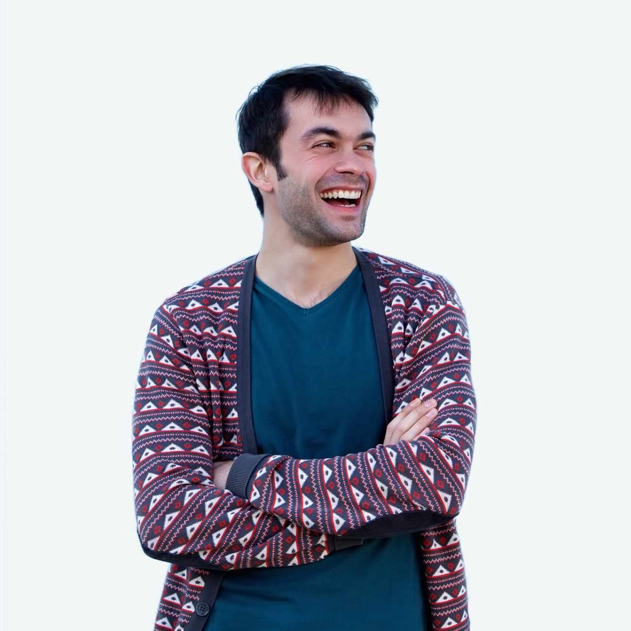 Young Man Smiling With Arms Crossed On Blue Backgr P9H3QU2